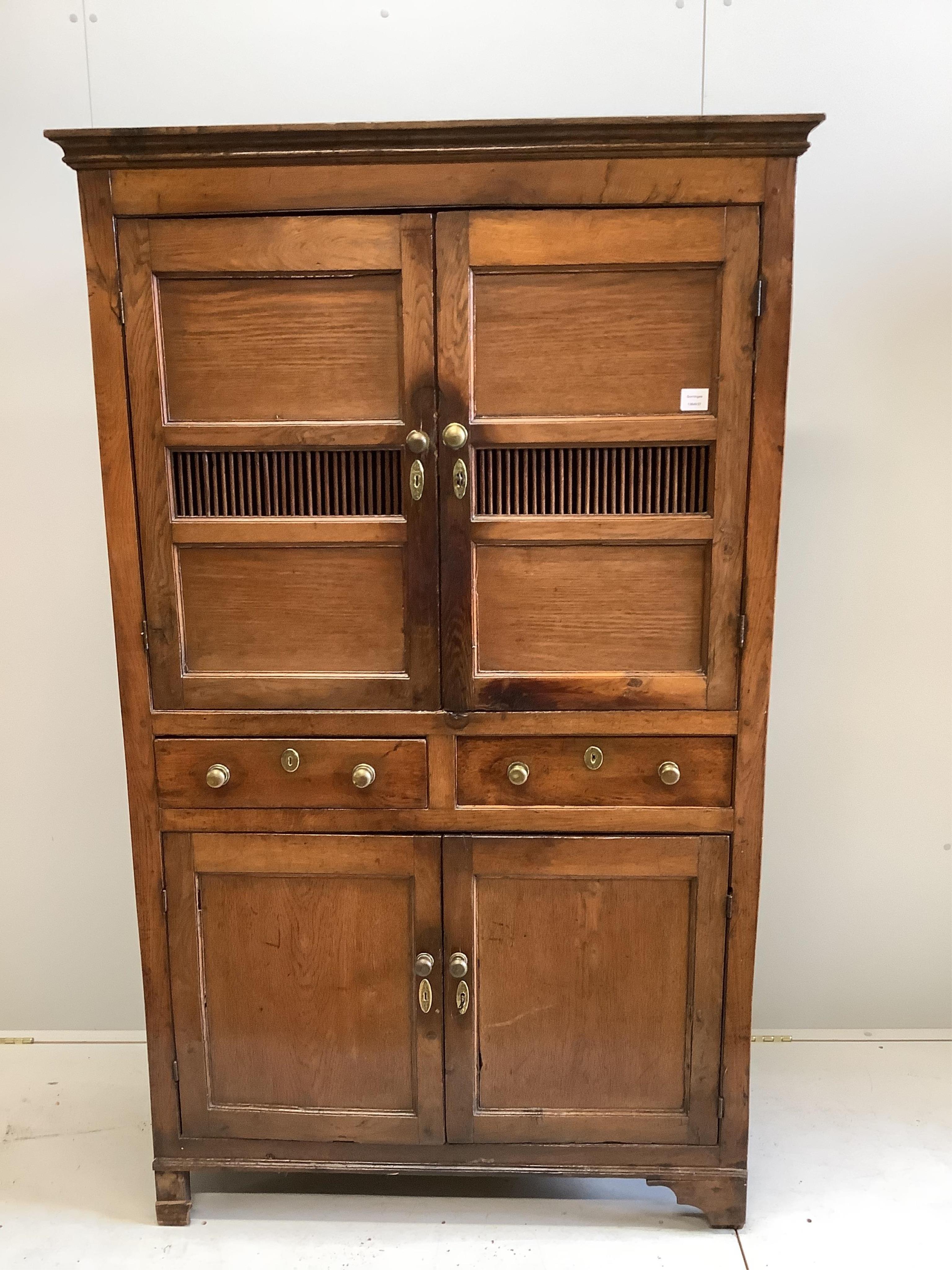 A late 18th century oak cupboard, width 113cm, height 186cm. Condition - fair to good